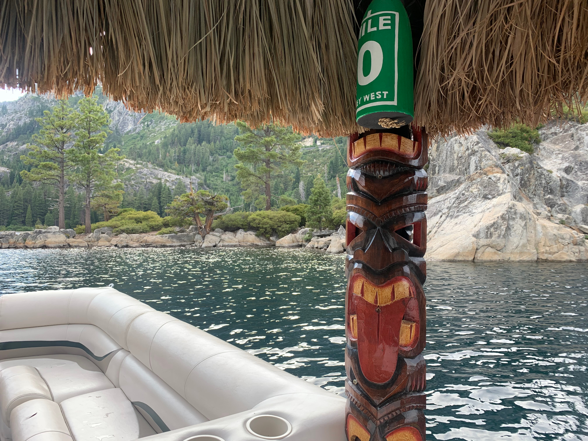 Tiki boat view of Emerald Bay's rocky shoreline